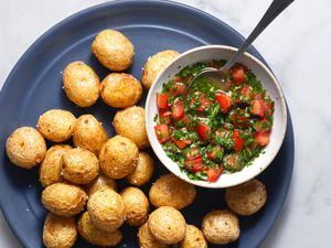 Aji (Colombian-Style Tomato and Onion Salsa) in a bowl, served with potatoes